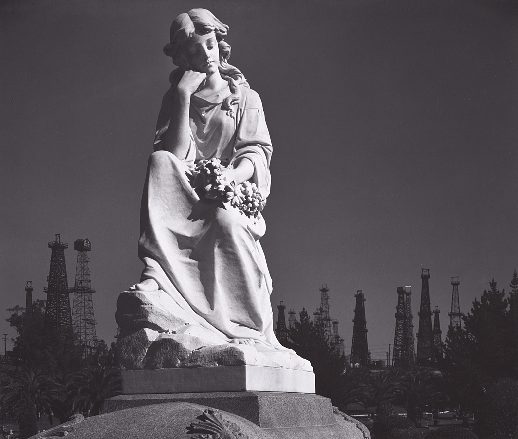 Cemetery Statue and Oil Derricks, Long Beach, California