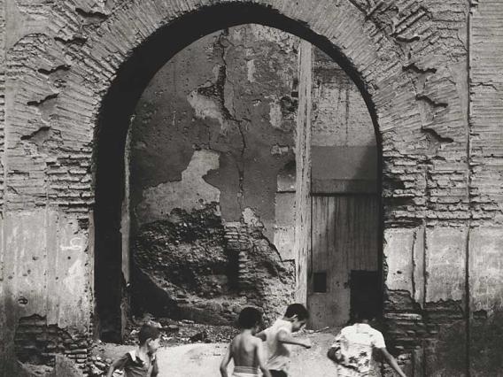 Max Yavno, Boys Playing Ball and Arch, 1982. Gift of Leonard and Marjorie Vernon. © 1998 Center for Creative Photography, The University of Arizona Foundation. 94.46.3